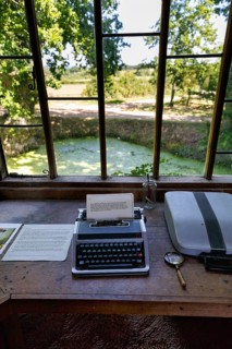 Typewriter with written text, desk in a pavilion overlooking the garden and moat, Sissinghurst