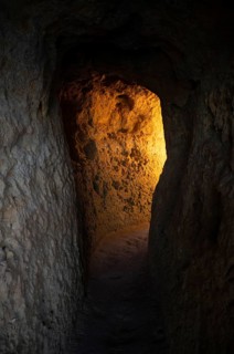Light at the end of the tunnel, Algar Seco rock formation, coloured rocks and underground caves,
