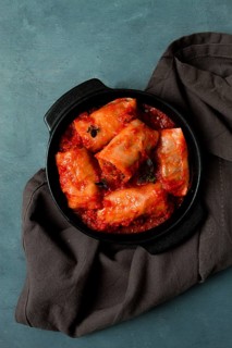 Stuffed cabbage rolls in tomato sauce stuffed cabbage leaves, minced meat with rice, on a dark