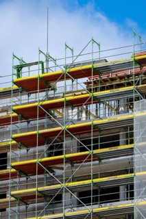 Essen, North Rhine-Westphalia, Germany - Scaffolding on the new building site of a high-rise block