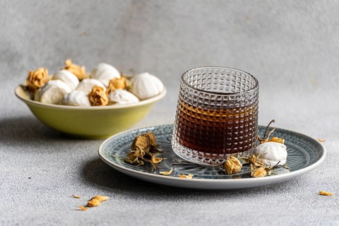 A delightful pairing of homemade vanilla mini zephyr-marshmallow filled with rose jam and an iced