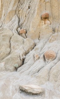 Detailed view of eroded clay formations featuring unique cannonball concretions at Theodore