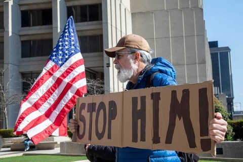 Detroit, Michigan USA - 7 April 2026 - People rally at the Federal Building to protest President