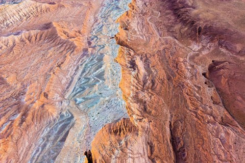 Aerial view of Vermilion Cliffs National Monument, Arizona, showcasing diverse red, orange, and