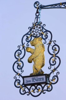 An artfully decorated metal sign with a golden bear, Erbach, Odenwald, Hesse, Germany