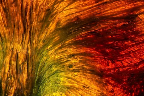 A stunning abstract of the Riotinto River in Huelva, Spain, showcasing vibrant yellow, orange, and