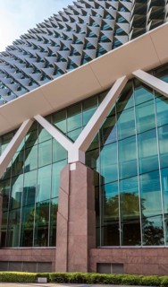 Part of modern futuristic building with strange roof in Singapore