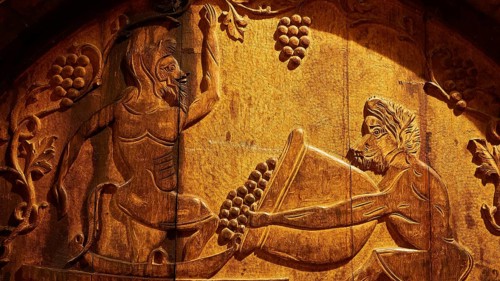 Detailed wood engraving on a wine barrel with antique art style, Achaia Clauss winery, Patras,