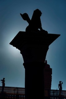 The Lion of Venice as a monument on the market square in the backlight, city trip, holiday, travel,