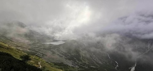 Mountains covered in fog with a distant lake in the background, Morskie oko, Zakopane, hiking in