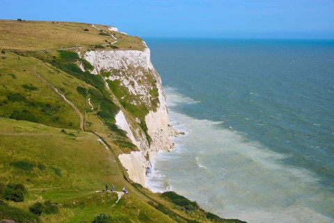 Panorama of cliffs and sea, with trails along the coastline, summer, chalk cliffs, English Channel,