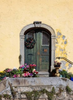 House entrance with floral decorations, town house, old town, Schärding, Innviertel, Upper Austria,