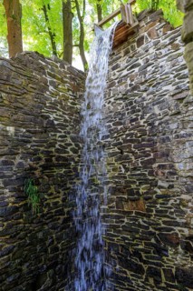 Ruins of the Sendig mill with wheel chamber and waterfall, oldest paper mill, Zwönitz, Erzgebirge,