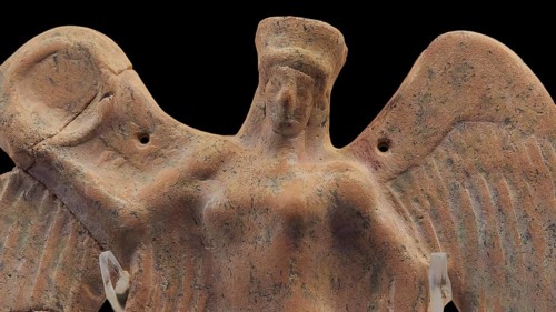Terracotta figure of the winged goddess of victory Nike, A terracotta statue with wings depicting a