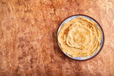 Stack of Plain Fried pancakes on brown concrete background. top view, flat lay, copy space