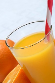 Orange juice in glass and orange