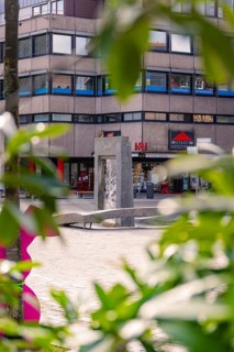 Modern fountain surrounded by green leaves in an urban environment, Nagold, Calw district, Germany