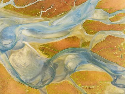 Streams at low tide in the marshland of the Walvis Bay lagoon. Aerial view. Drone shot. Walvis Bay,
