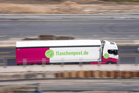 Freight truck for food logistics, on the highway, drinks and food delivery service Message in a