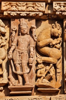 Stone carving bas relief sculptures on Adinath Jain Temple, Khajuraho, Madhya Pradesh, India