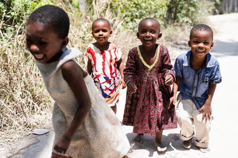 MICHAMVI KAE, ZANZIBAR - OCTOBER 17, 2025: Group of happy and laughing African children playing and