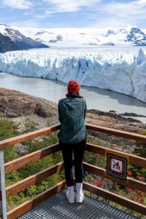 Young woman looking at the Perito Moreno Glacier, El Calafate, Santa Cruz Province, Argentina