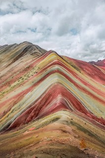 The vivid striations of Vinicunca, known as Rainbow Mountain, showcase a breathtaking view of