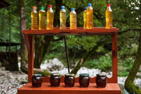 MARTVILI, GEORGIA - AUGUST 21, 2023: a stall with local products chacha and syrup from cones