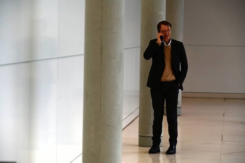 Karl Lauterbach (SPD) on the phone in front of the SPD parliamentary group meeting room