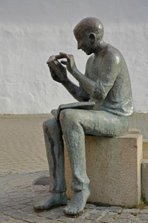 Sculpture Book reader at the fountain in front of the town library, reader, literature, books,