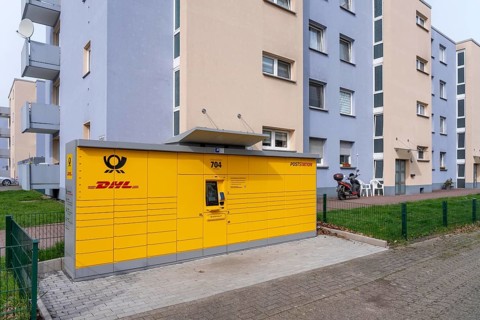 DHL packing station in a residential area, in Duisburg-Neuenkamp, receiving and sending parcels and