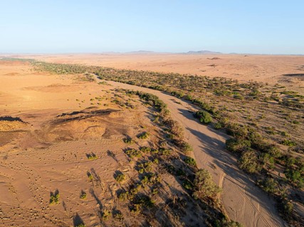 Aerial view, dry riverbed and desert landscape at Ugab River, Erongo, Damaraland, Namibia