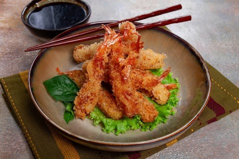 Shrimp in tempura, deep fried, with soy sauce, close-up, top view, without people
