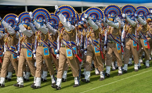 Central Reserve Police Force (CRPF) personnels march in ceremonial formation during a parade held