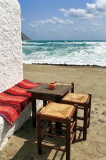 Simple wooden table with bench and stools outdoors, bar, beach bar with sea view, Cabo de Gata