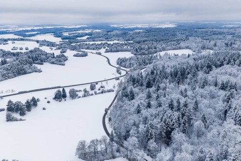 Snow-covered hills and forests in a wide landscape, seen from above, Gechingen, Calw district,