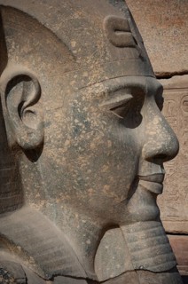 Luxor, Egypt. February 12th 2009 Stone Pharaonic Head Pharaonic inscriptions at the ancient