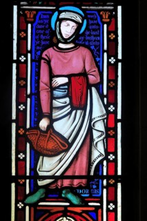 Stained glass lancet window picture of Dorcas, Church of Saint Mary, Uggeshall, Suffolk, England,