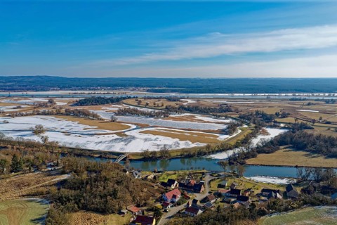 Ice and snow-covered foothills of the Oder in the Lower Oder Valley National Park. aerial view.