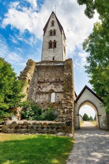 Gothem Castle medieval defence tower, ruins, church of Gothem, stone country church, portal, east