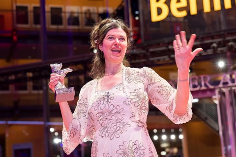 Anna Fitch (US director) poses with the Silver Bear for Outstanding Artistic Achievement for the