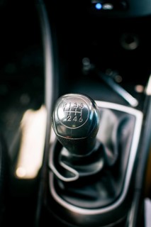 Gear lever of a vehicle. Close up of a car gear lever, Close up of a car gear knob. Detail view of