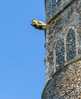 Historic gargoyle on tower church of Saint Peter, Theberton, Suffolk, England, UK