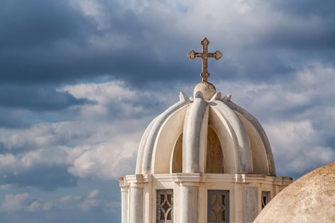 Scenic Christian Church Dome and Crucifix with Cloudy Background