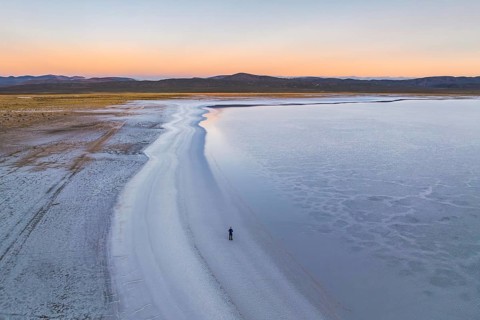A breathtaking view of Salinas Grandes in Salta, Argentina, displaying expansive salt flats under a