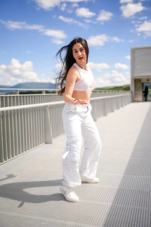 Vertical full length of a caucasian beauty young woman moving dancing urban music