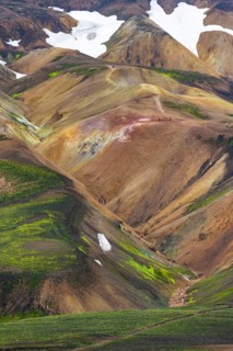 Small river between colourful rhyolite mountains, volcanic landscape, erosion landscape, view from