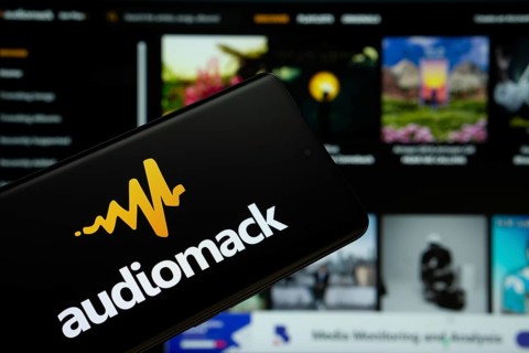 Audiomack logo is seen on a smartphone