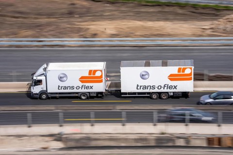 Freight truck from freight and logistics service provider trans-o-flex, on the motorway