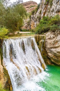 Waterfall next to the path on the Vero River walkways in Alquezar. Huesca Pyrenees